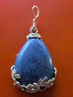 Sterling Silver Foral Motif Pendant with Lapis center